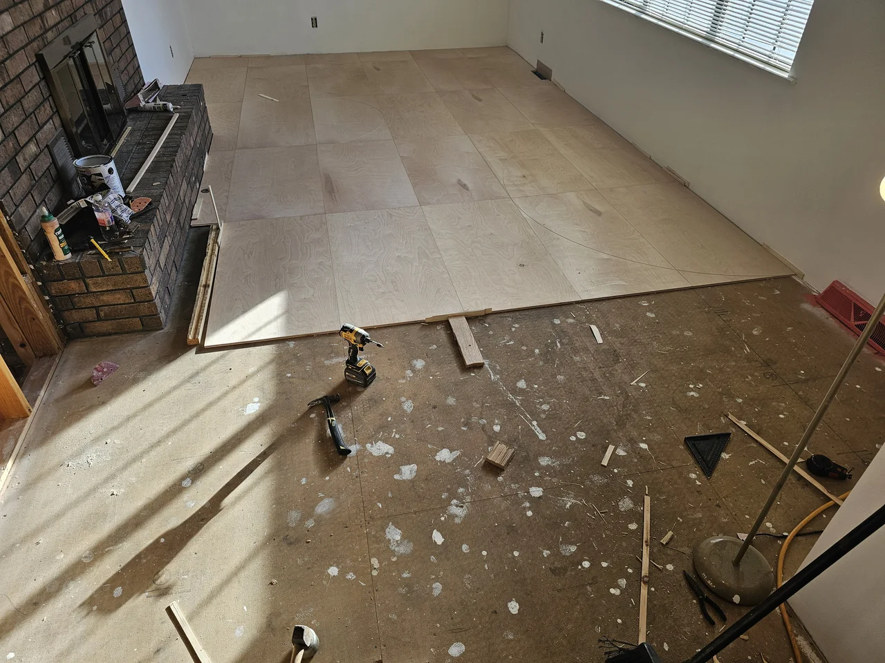 Curved inlay panels fitted into the birch floor field with tight seams.