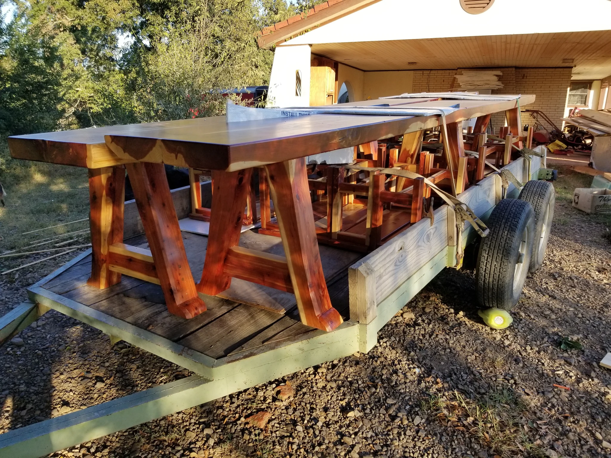 A finished cedar table loaded onto a trailer for delivery.