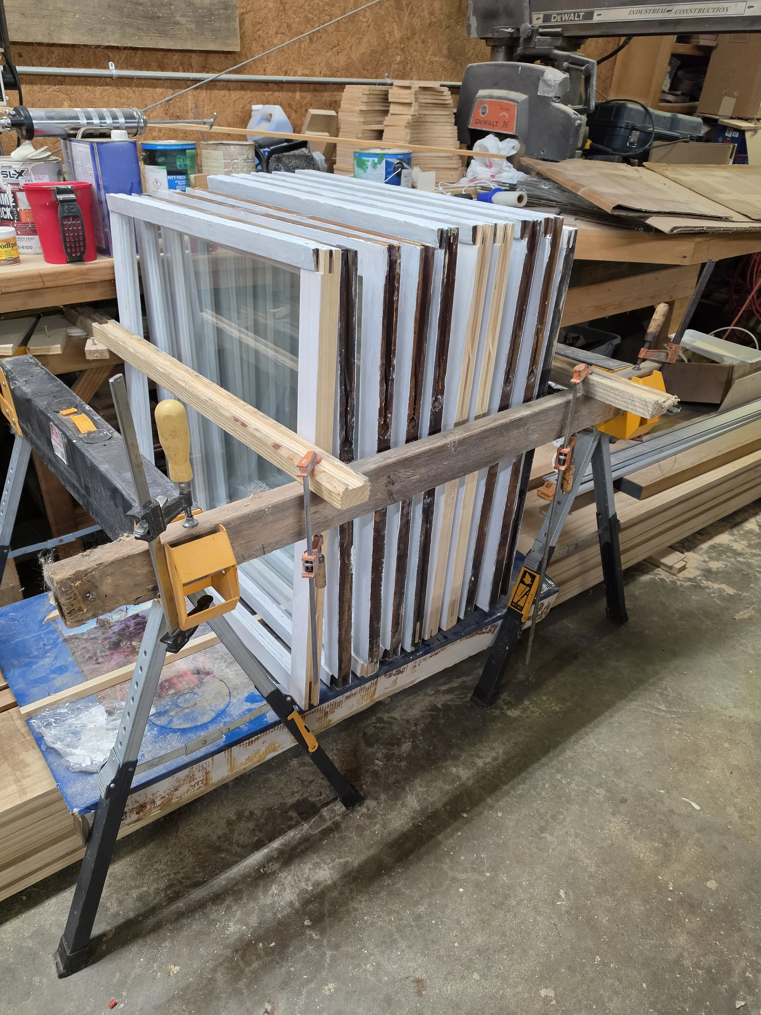 A badly deteriorated wooden window member with rot through the section.