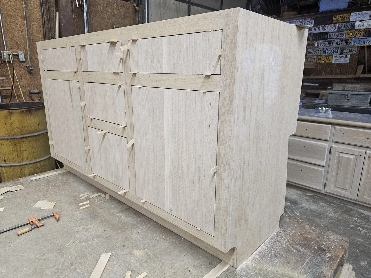 A shop-built vanity carcass with face frame in a cerused white finish.