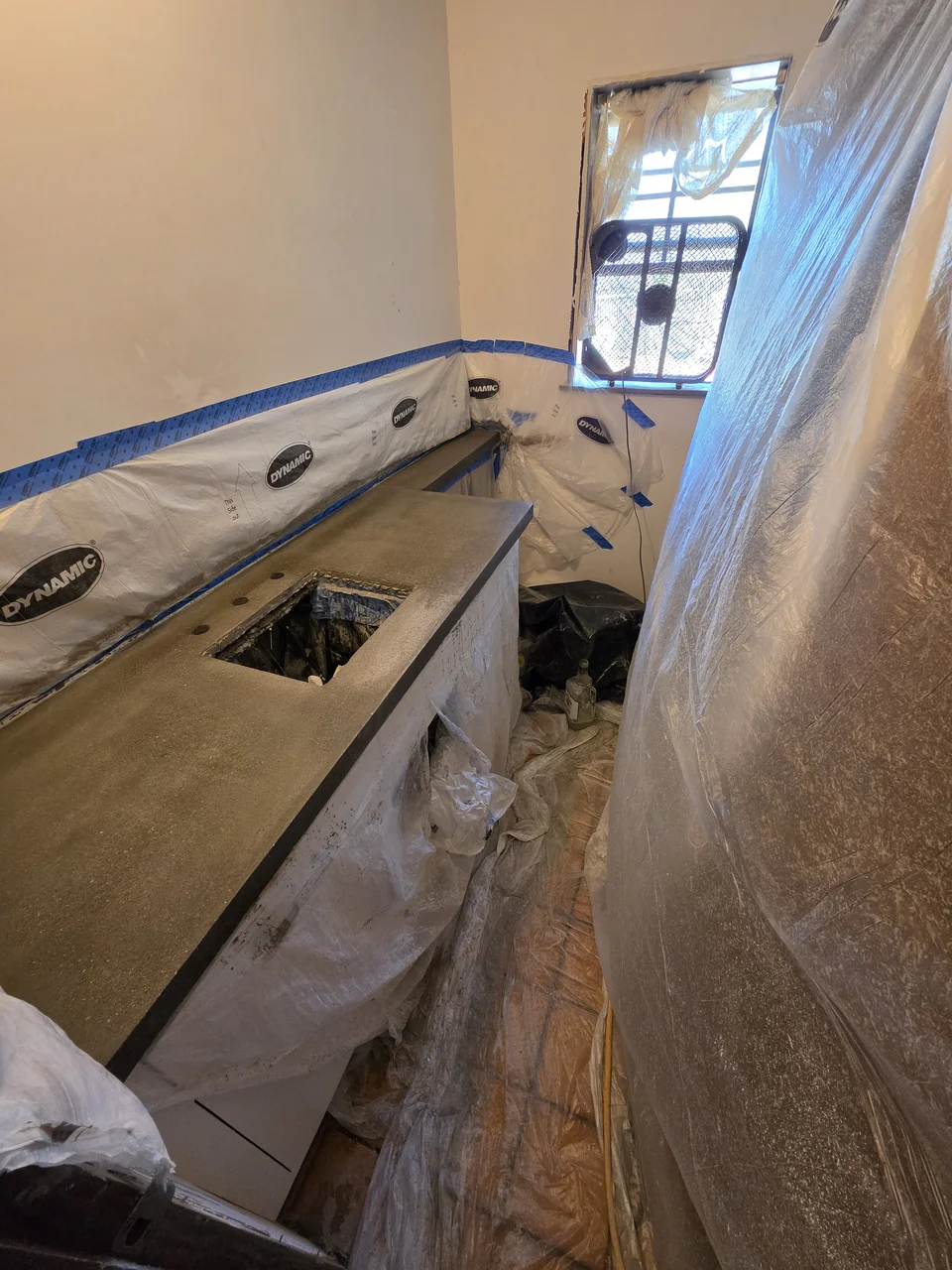 The concrete countertop cast in place with the room masked off around it.