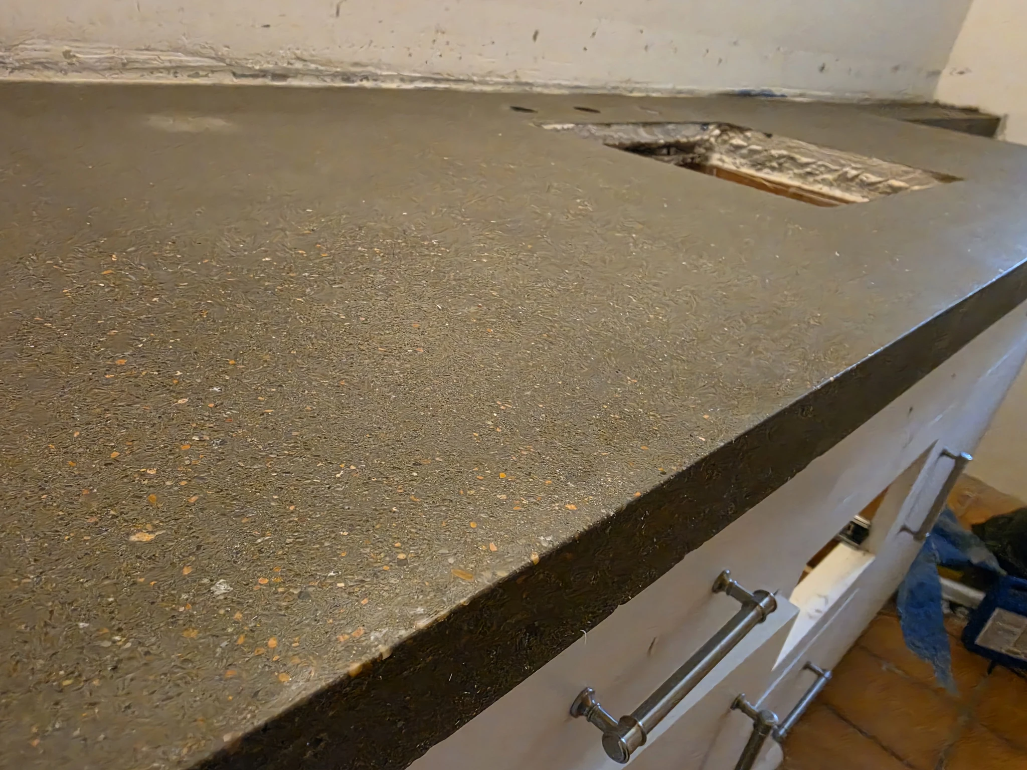 The finished cast concrete countertop showing its textured edge profile.