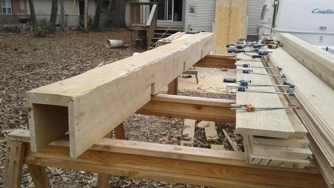 The built-up box beam clamped up on horses in the shop.