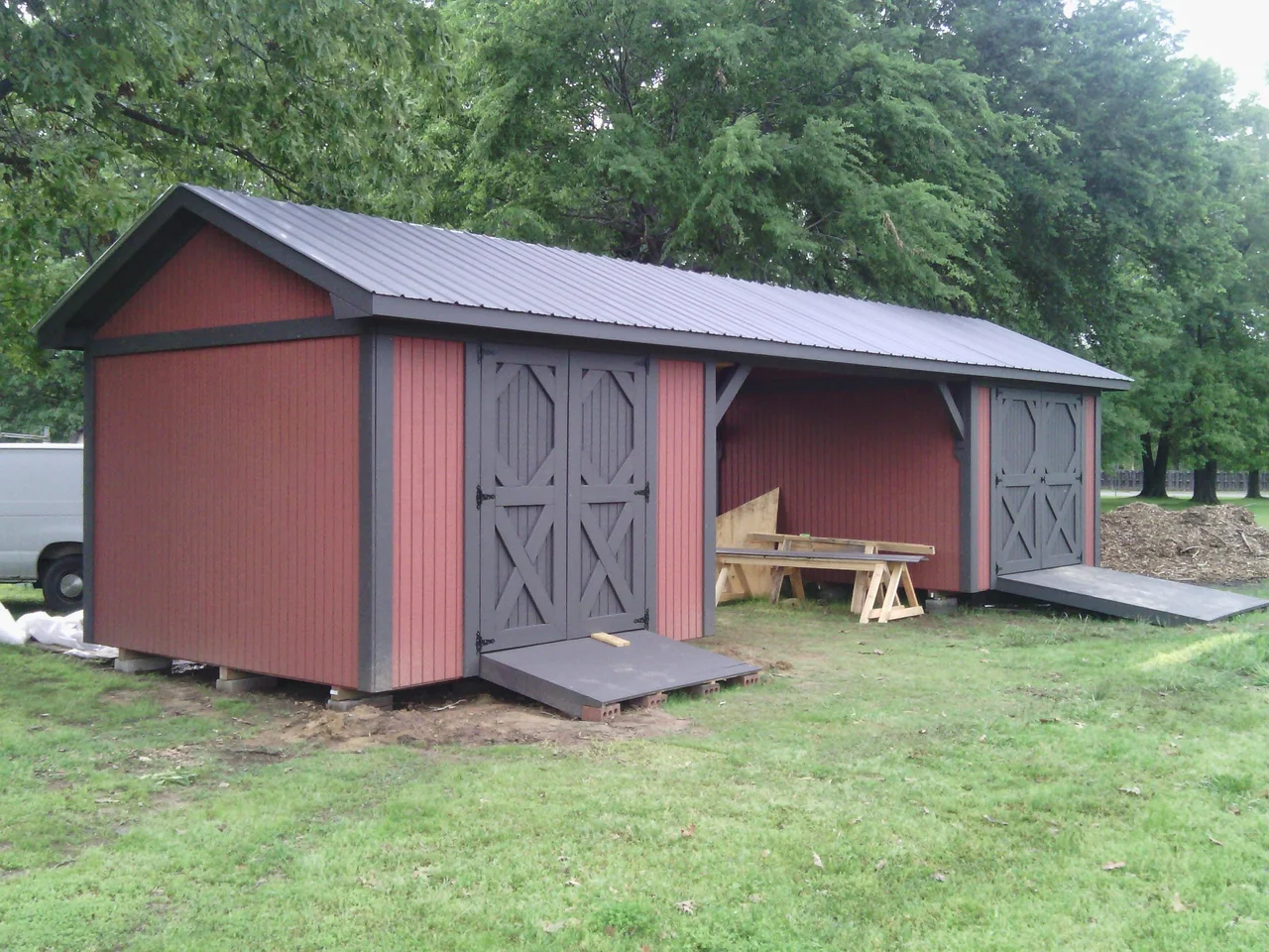 The completed dogtrot shed, both bays and breezeway under a metal roof.