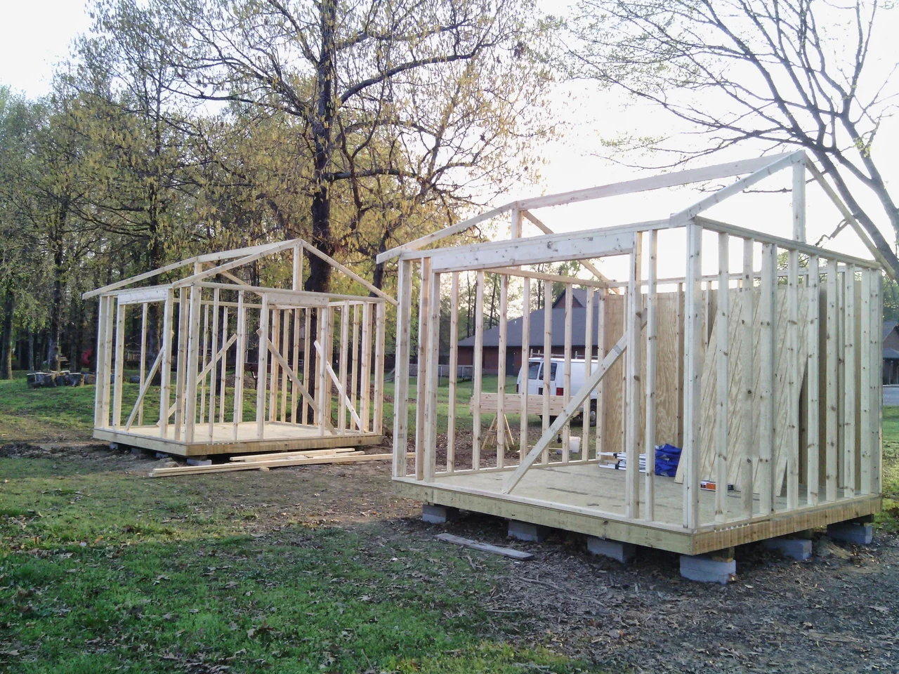 The shed framing standing on skids before sheathing.