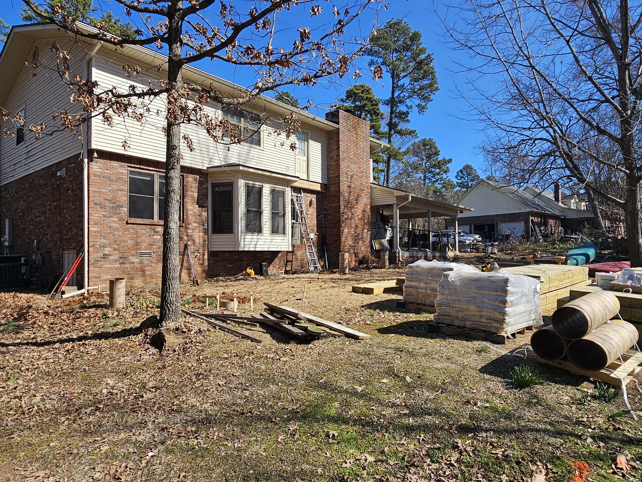 The bare, sloped rear yard before construction began.
