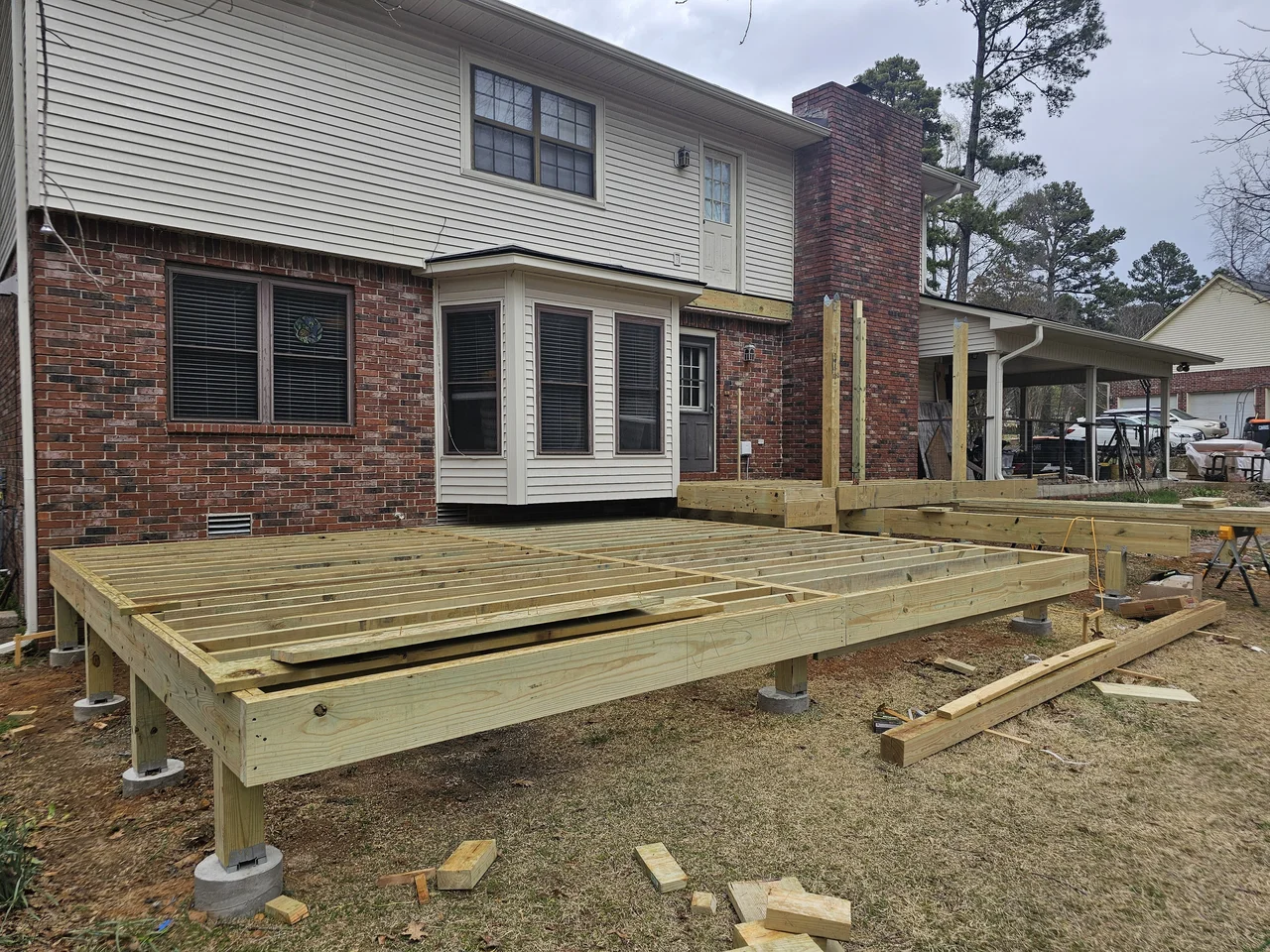 The deck platform framed on posts and pier footings.