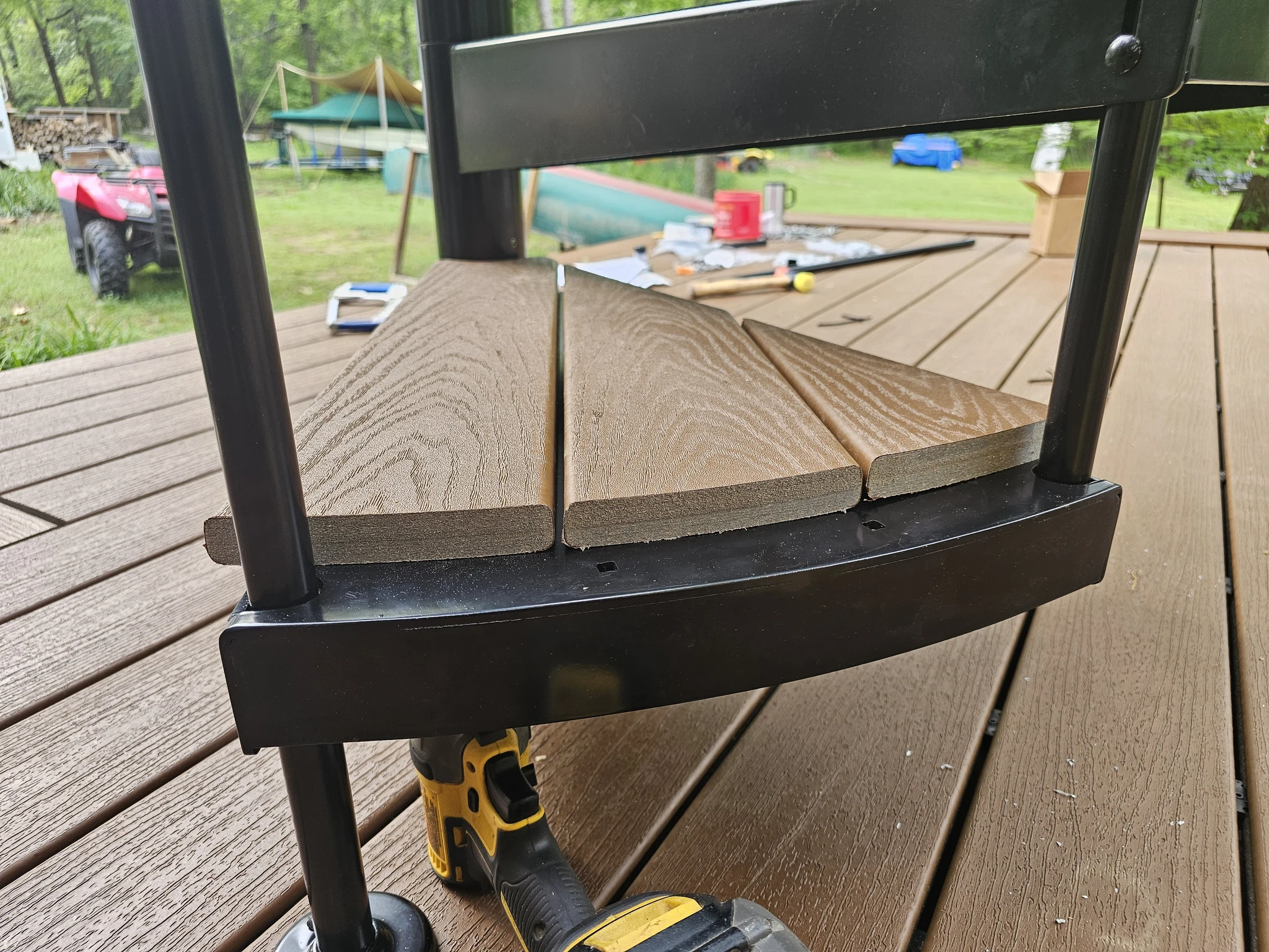 The stair landing where the spiral stair meets the deck framing.