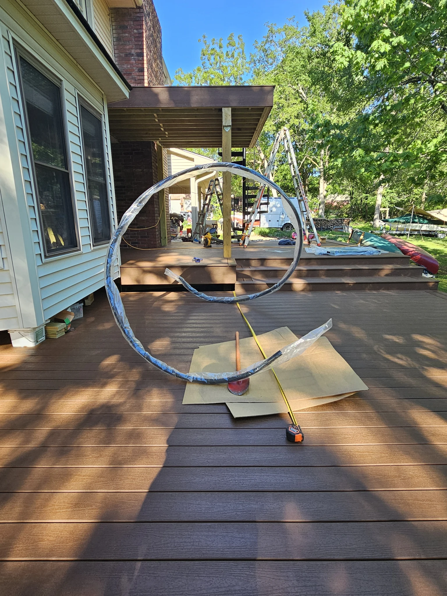 The handrail hoop lying flat on the deck before installation.