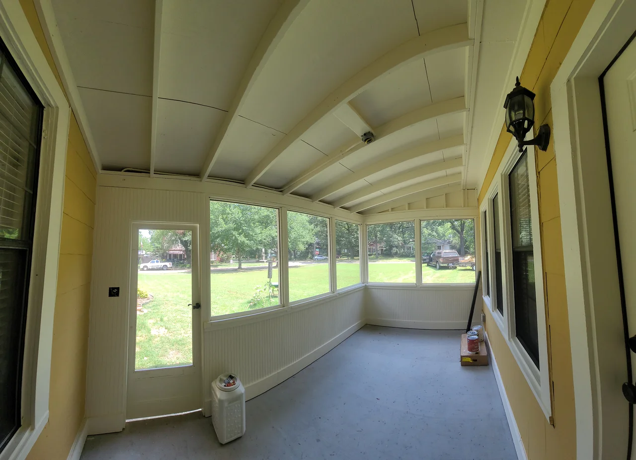 Interior view of the finished porch ceiling and wraparound windows.