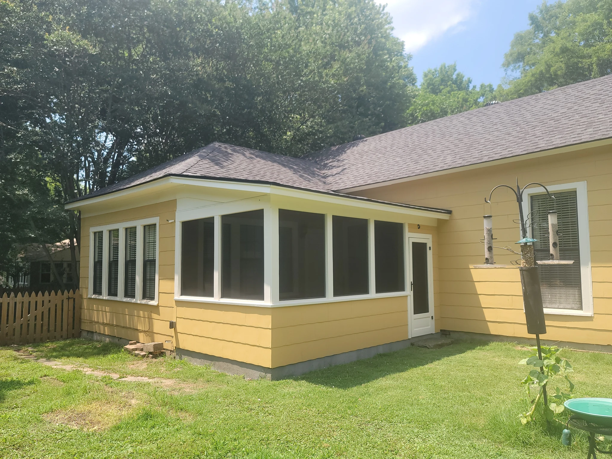 The completed screened porch addition seen from the lawn.