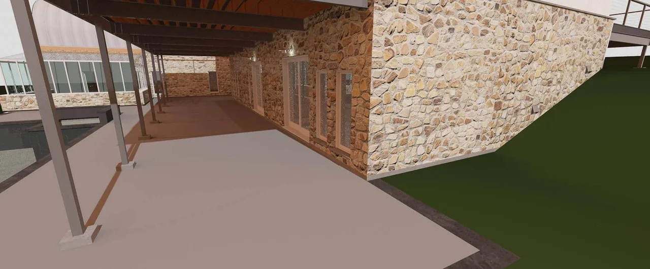 A rendering of the covered walkway beneath the house, running along a stone wall.