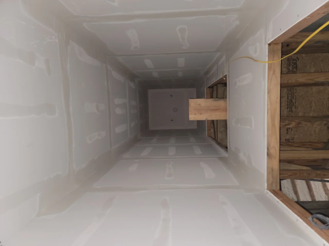 The elevator shaft finished in drywall.