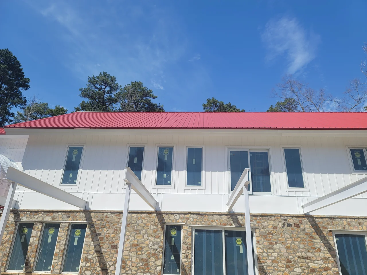 The elevation with steel columns carrying the walk and glazing behind.