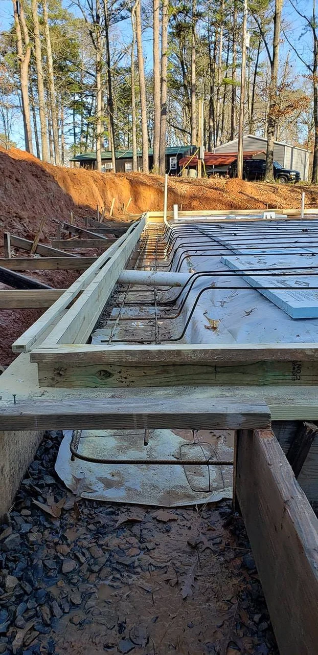 Formed concrete footings with rebar set, ready to pour.
