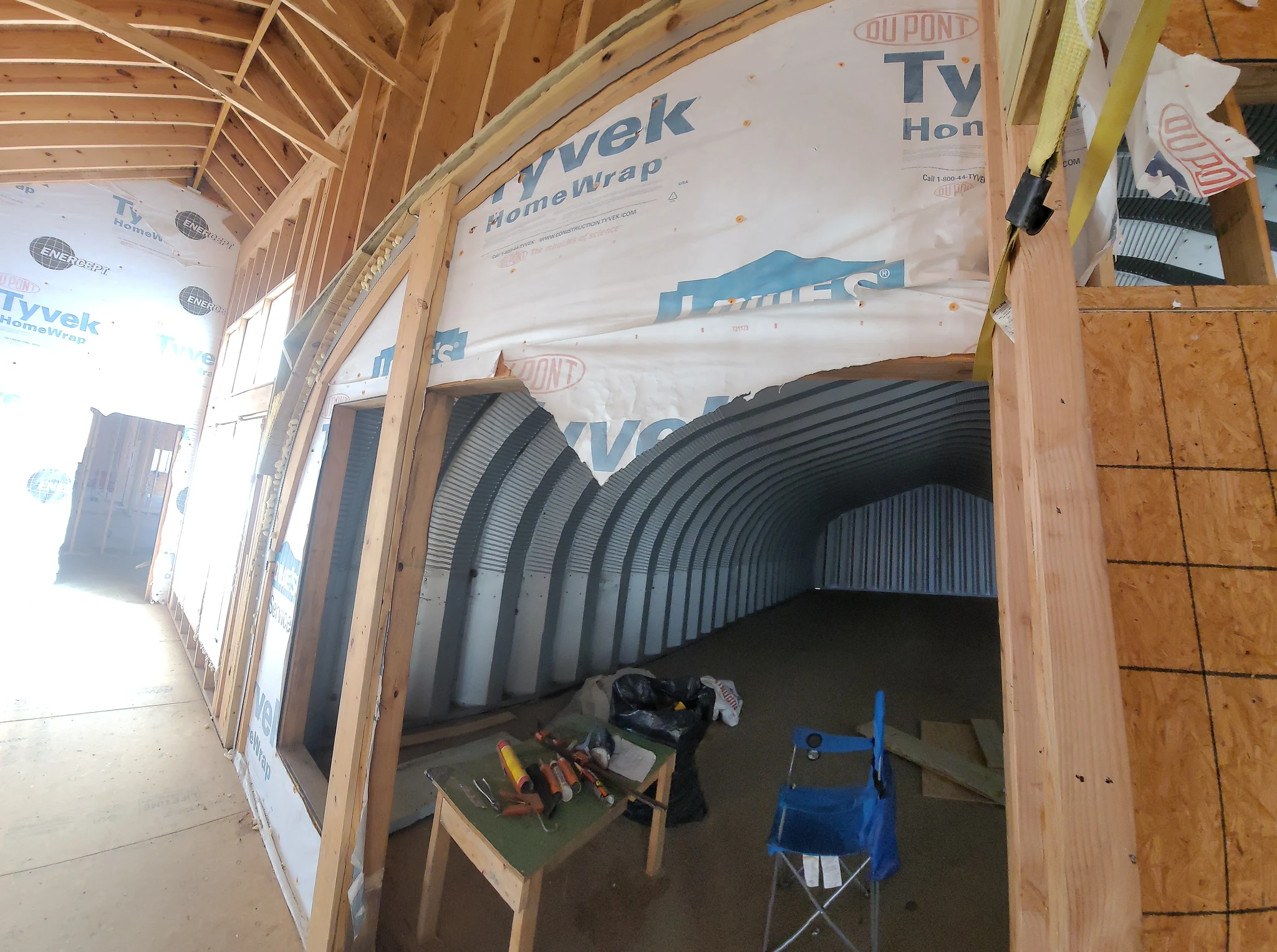 Interior view down the full length of the steel arch structure.
