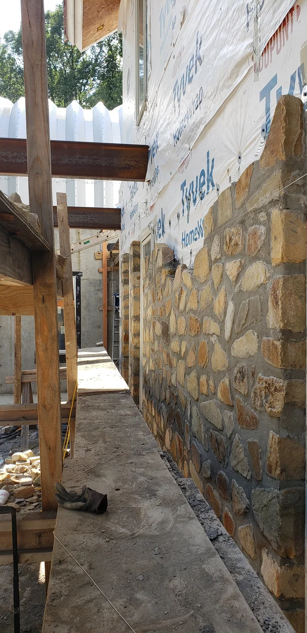 A narrow view along the finished stone wall.