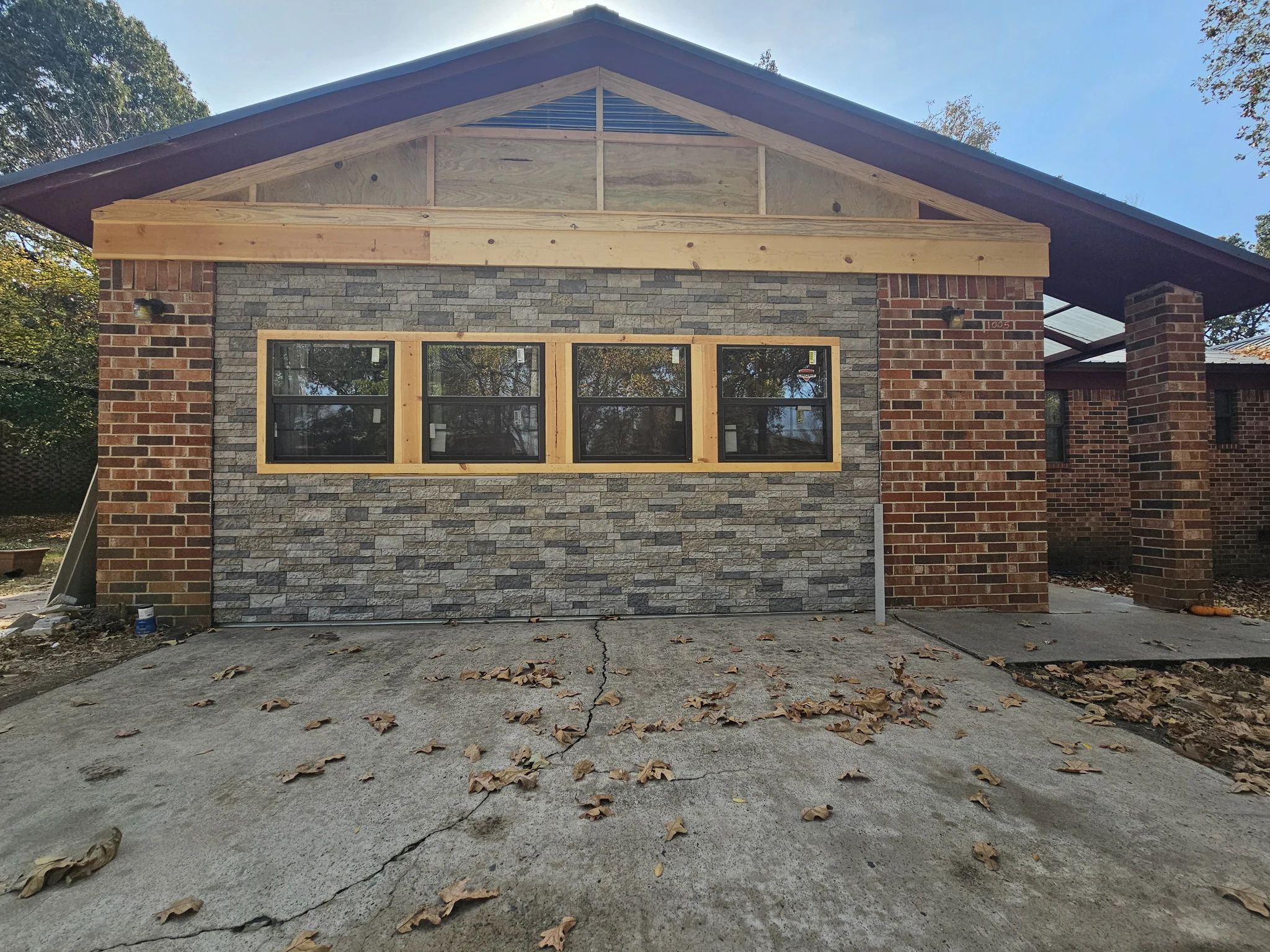 Detail of the finished gable with stone veneer below.