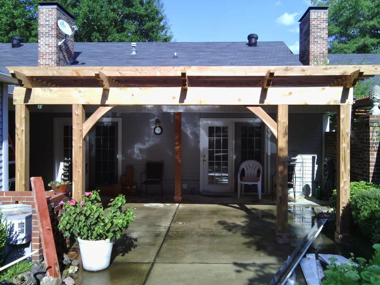 The completed pergola seen frontally from the patio.